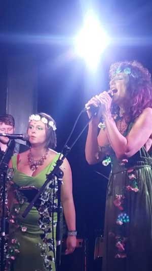 Nymphya and Rose Thorn singing on stage at the Dreamery concert in Lichfield